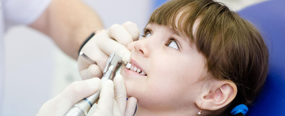 Girl getting her teeth clean